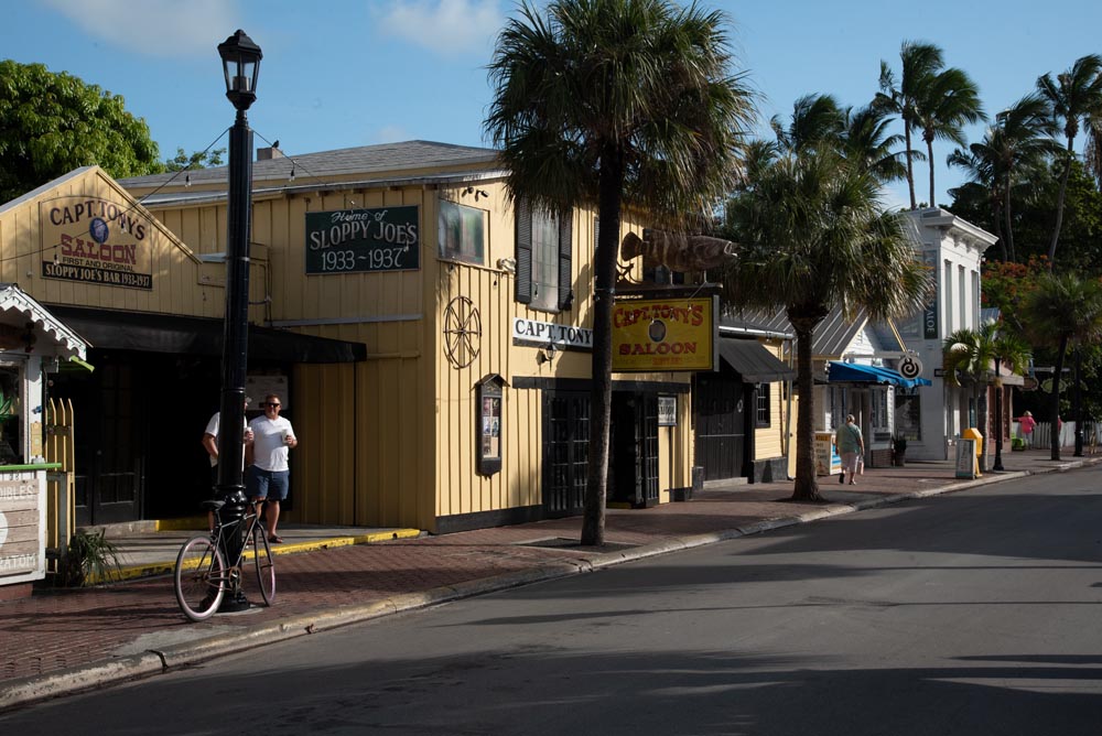 The yellow sided Capt. Tony's Saloon on a palm lined street.