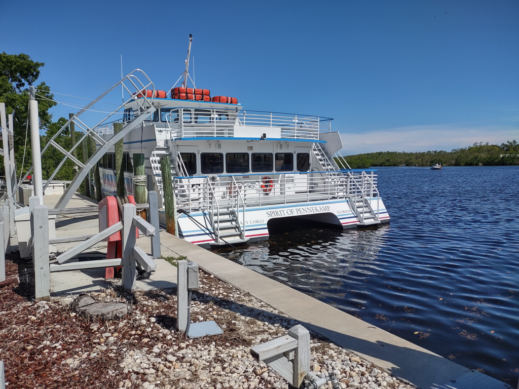 The boat "Spirit of Pennekamp" is docked on the shore of John Pennekamp Coral Reef State Park