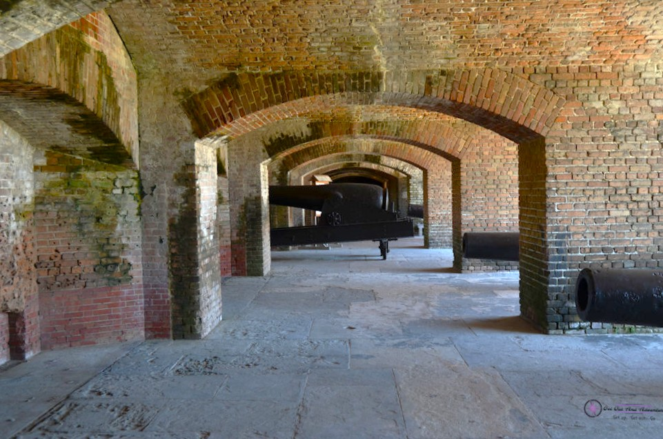 Looking down the hallway of Fort Zachery Taylor, in the distance stands a civil war era canon under arched supports.  One spot to visit on three days in Key West.