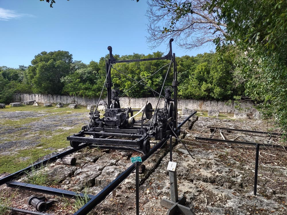 Old machinery sits on rails overlooking a quarry at Windley Key State Park.