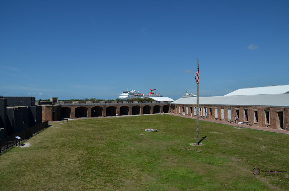 A cruise ship can be seen beyond the walls of Fort Taylor and can be seen on your Key West Vacation.  An American Flag hangs in the courtyard.